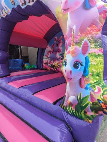 Children playing inside the 12x12ft 3D Unicorn Contoured Bouncer