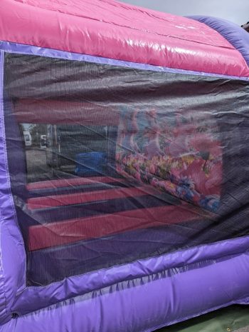 Get a glimpse of the generous 12x12ft bouncing area from the side. Our unicorn bouncy castle offers ample space for kids to enjoy endless bouncing fun