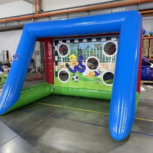 Children playing with inflatable football goals at a birthday party by Wild Atlantic Bouncy Castles